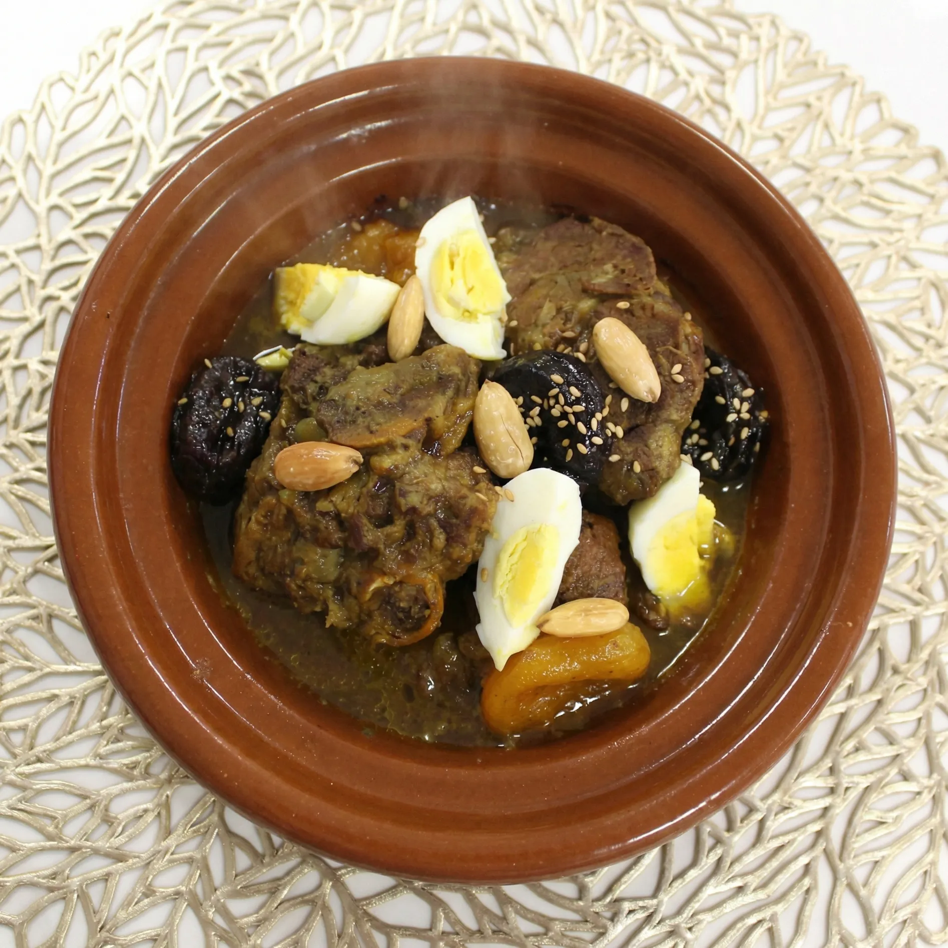 Lamb Tajine with Prunes at Tajine House Restaurant Edmonton - tender lamb slow-cooked with caramelized prunes and almonds
